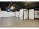 Spacious unfinished basement with concrete floor, open ceiling, and painted walls at 621 Melvenia St, Indianapolis, IN 46219