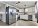 Modern kitchen featuring stainless steel appliances, white cabinets, subway tile backsplash and hardwood floors at 621 Melvenia St, Indianapolis, IN 46219
