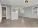Spacious living room with new flooring, open to other rooms in the house at 621 Melvenia St, Indianapolis, IN 46219