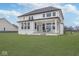 Expansive backyard featuring a covered patio and large windows, perfect for outdoor living at 6609 N Dogwood Dr, McCordsville, IN 46055