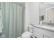 Bathroom featuring vanity with gray countertop, gray shower curtain, and silver hardware at 6609 N Dogwood Dr, McCordsville, IN 46055