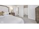 Inviting bedroom featuring carpeted floor, natural light, furniture and access to an en suite bathroom at 6609 N Dogwood Dr, McCordsville, IN 46055