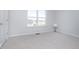 Bright bedroom with a large window and neutral carpet. Perfect for relaxation at 6609 N Dogwood Dr, McCordsville, IN 46055