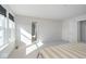 Spacious bedroom bathed in sunlight, featuring plush carpeting and view to an en suite bathroom at 6609 N Dogwood Dr, McCordsville, IN 46055