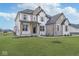 Charming two-story home with stone details, lush lawn, and inviting curb appeal at 6609 N Dogwood Dr, McCordsville, IN 46055