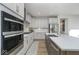 Modern kitchen with stainless steel appliances, quartz countertops, and custom cabinetry at 6609 N Dogwood Dr, McCordsville, IN 46055