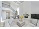 Airy living room features a stunning fireplace, modern staircase, and ample seating at 6609 N Dogwood Dr, McCordsville, IN 46055