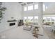 Spacious living room boasts soaring ceilings, natural light, modern fireplace, and comfortable seating at 6609 N Dogwood Dr, McCordsville, IN 46055