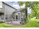 Home with backyard deck and patio, mature trees, and manicured lawns at 7160 Harbour, Indianapolis, IN 46240