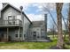 Backyard featuring a deck/patio, mature landscaping and gray siding at 7160 Harbour, Indianapolis, IN 46240