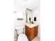 Bathroom features a sink with wood cabinets and modern fixtures at 7160 Harbour, Indianapolis, IN 46240