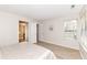 Bright bedroom featuring an ensuite bathroom, hardwood floors and a large window at 7160 Harbour, Indianapolis, IN 46240