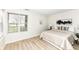 Bright bedroom features a large window and hardwood floors, creating a cozy and inviting atmosphere at 7160 Harbour, Indianapolis, IN 46240