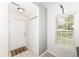Bright entryway featuring a white door, closet, and large window offering natural light at 7160 Harbour, Indianapolis, IN 46240
