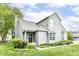 Charming home with shake siding, landscaped garden with colorful flowers, and inviting front entrance at 7160 Harbour, Indianapolis, IN 46240