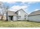 Charming two-story home features a cedar shake exterior, well-maintained lawn, and a classic architectural design at 7160 Harbour, Indianapolis, IN 46240