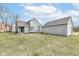 Home with well-maintained lawn and gray siding, complemented by an attached garage at 7160 Harbour, Indianapolis, IN 46240