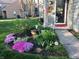 Well-manicured front yard with flower beds and walkway leading to the home's entrance at 7160 Harbour, Indianapolis, IN 46240
