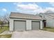 Detached two-car garage featuring matching cedar shake exterior and easy access to the main house at 7160 Harbour, Indianapolis, IN 46240