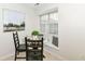Bright eat-in kitchen area features a window and an artistic wall decoration at 7160 Harbour, Indianapolis, IN 46240