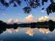 Lake view at sunset with the clouds reflected in the calm waters below at 7160 Harbour, Indianapolis, IN 46240