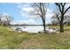 Scenic lake view with boats, surrounded by mature trees at 7160 Harbour, Indianapolis, IN 46240