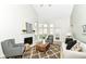 Bright living room featuring a fireplace, large windows, and a comfortable seating area at 7160 Harbour, Indianapolis, IN 46240