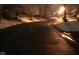 Residential street covered in snow in a neighborhood with street lighting at 7160 Harbour, Indianapolis, IN 46240