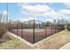 Community tennis court with a black fence and Harbour Club signage on the net at 7160 Harbour, Indianapolis, IN 46240