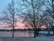 A panoramic view of a snow-covered landscape, complete with a serene lake at 7160 Harbour, Indianapolis, IN 46240