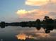 A peaceful view of the lake, showcasing the serene water reflecting the clouds at 7160 Harbour, Indianapolis, IN 46240