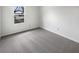 Bright bedroom with large window and neutral colored carpet at 7228 Muirfield Pl, Indianapolis, IN 46237