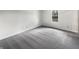 Bedroom with natural light from a window and soft gray carpet at 7228 Muirfield Pl, Indianapolis, IN 46237