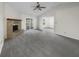Spacious living room featuring vaulted ceilings, stone fireplace, new carpet, and plenty of natural light at 7228 Muirfield Pl, Indianapolis, IN 46237