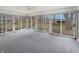 Bright sunroom featuring sliding windows with views of the backyard at 7228 Muirfield Pl, Indianapolis, IN 46237