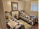 Bedroom with two beds, each decorated with comfortable gray and blue quilted covers at , Indianapolis, IN 46217