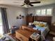 Cozy bedroom features a comfortable bed, dresser, and natural light, creating a peaceful retreat at , Indianapolis, IN 46217