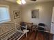 Bright bedroom with a white bed frame, wood floors, and a lovely elephant plushie at , Indianapolis, IN 46217