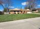 Traditional single-story brick home with a neatly manicured lawn and mature trees at , Indianapolis, IN 46217