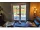 Cozy living room with sliding glass doors leading to a patio, offering natural light and indoor-outdoor flow at , Indianapolis, IN 46217