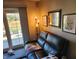 Cozy living room featuring a comfortable couch, bright lighting, and a sliding glass door to the patio at , Indianapolis, IN 46217
