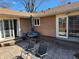 Outdoor patio with chairs offers a relaxing space, complemented by the home's cozy exterior at , Indianapolis, IN 46217