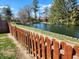 Scenic pond view with a charming wooden fence, enhancing the natural beauty of the property at , Indianapolis, IN 46217