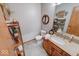 Bathroom with shelving, and a vanity with granite countertops, and a decorative mirror at 802 Burwick Trce, Greenwood, IN 46143