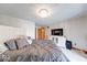 Comfortable bedroom featuring a queen-sized bed, modern lighting, and entertainment center at 802 Burwick Trce, Greenwood, IN 46143