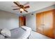 Bedroom featuring a single bed, wood doors and ceiling fan at 802 Burwick Trce, Greenwood, IN 46143