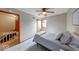 Bedroom featuring a single bed, ceiling fan and an open hallway at 802 Burwick Trce, Greenwood, IN 46143