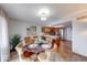 Dining area with round table and seating, looking into the open floorplan kitchen at 802 Burwick Trce, Greenwood, IN 46143