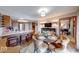 A dining room with table, looking into the kitchen featuring a breakfast bar and stainless appliances at 802 Burwick Trce, Greenwood, IN 46143