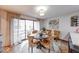 Dining area features a sliding glass door to the deck, as well as views into the kitchen at 802 Burwick Trce, Greenwood, IN 46143
